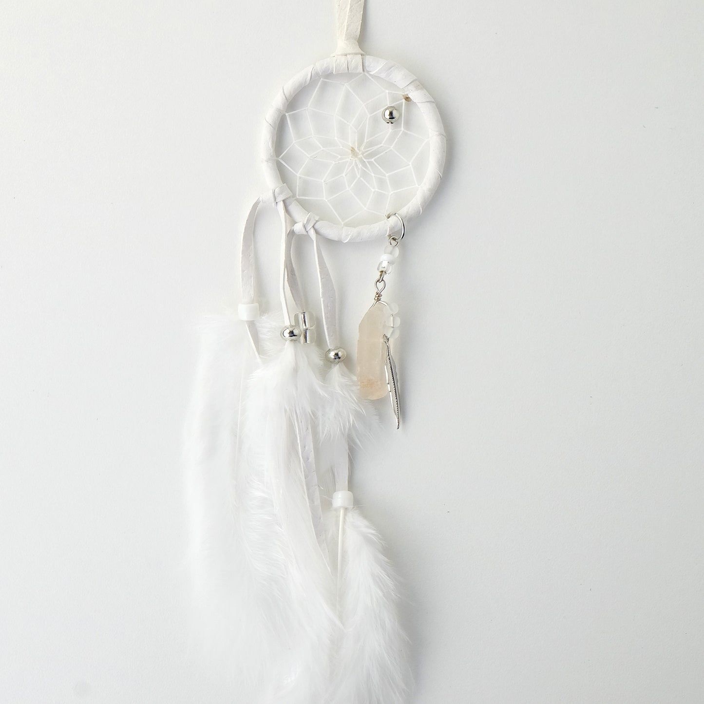 2" White Magical Dream Catcher   2" White Magical Dream Catcher detailed with quartz crystal. DC620WHT